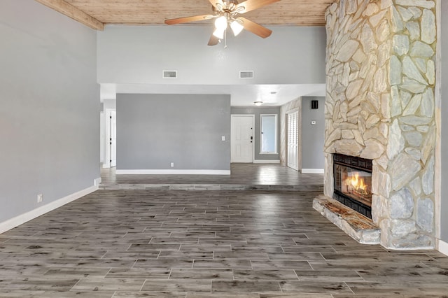 unfurnished living room with hardwood / wood-style floors, a fireplace, and wooden ceiling