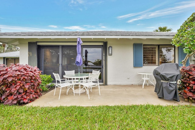 rear view of house featuring a patio