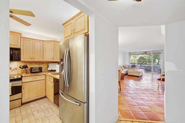 kitchen with light brown cabinetry, black appliances, ceiling fan, light stone countertops, and backsplash