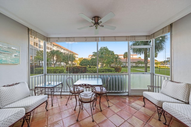 sunroom featuring ceiling fan