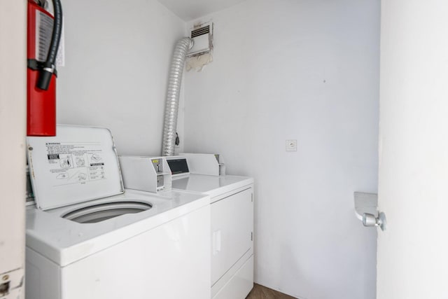 laundry area featuring washing machine and clothes dryer