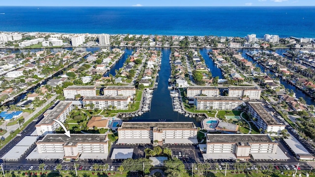 birds eye view of property with a water view