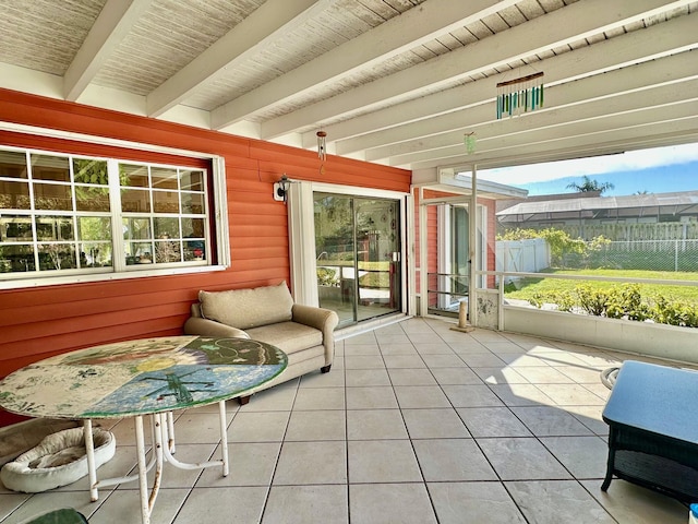 sunroom / solarium featuring wood ceiling and beamed ceiling