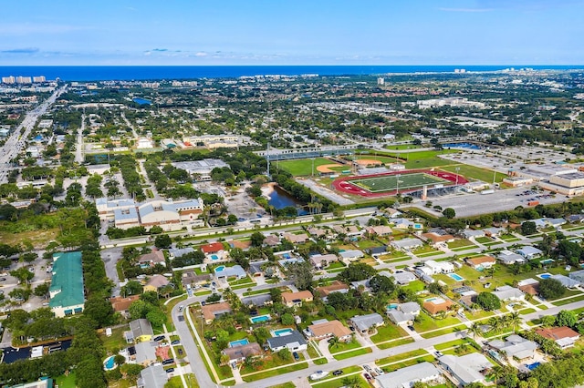 drone / aerial view with a water view and a residential view