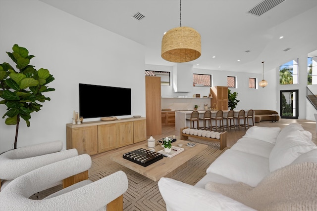 2578 Players Ct, Wellington, FL 33414 - living room featuring light hardwood / wood-style flooring and a high ceiling