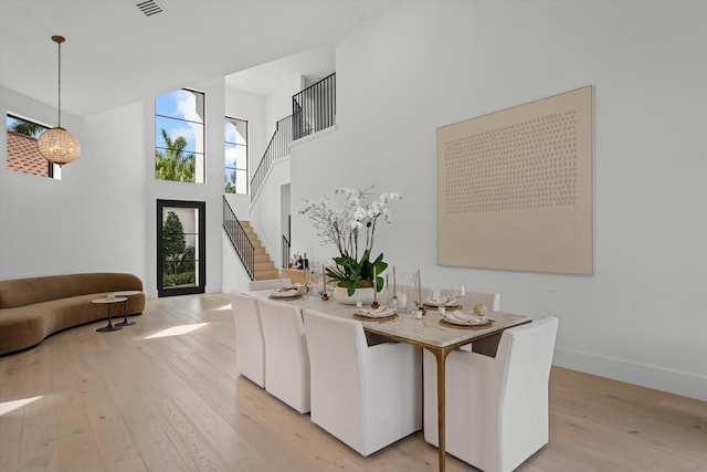 2578 Players Ct, Wellington, FL 33414 - dining room featuring light hardwood / wood-style flooring and a high ceiling