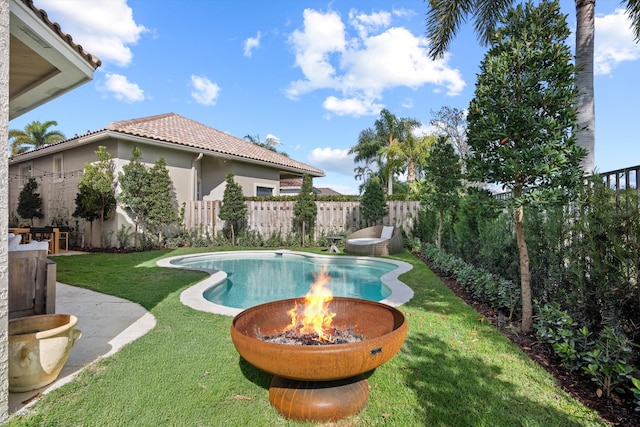 2578 Players Ct, Wellington, FL 33414 - view of swimming pool with a yard and an outdoor fire pit