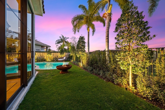 2578 Players Ct, Wellington, FL 33414 - yard at dusk with a fenced in pool