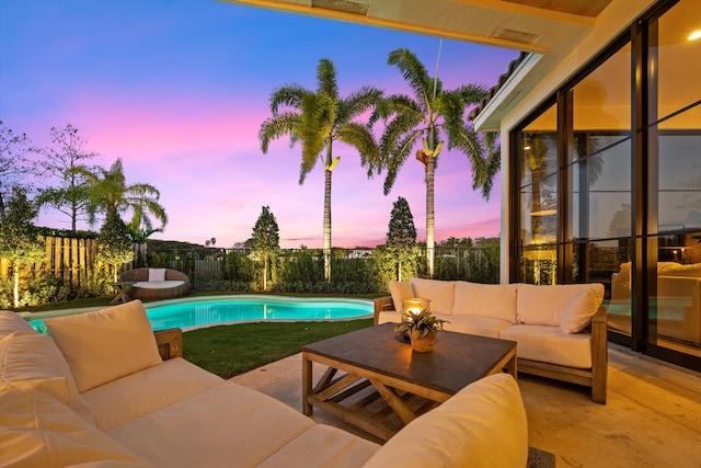 2578 Players Ct, Wellington, FL 33414 - pool at dusk featuring outdoor lounge area and a patio area