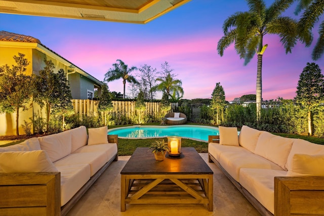 2578 Players Ct, Wellington, FL 33414 - pool at dusk featuring outdoor lounge area and a patio