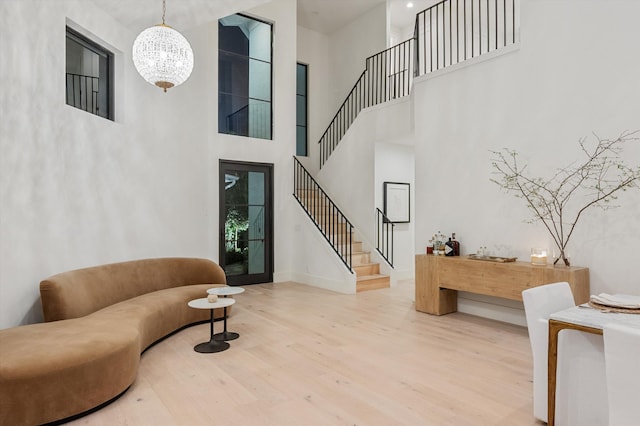 2578 Players Ct, Wellington, FL 33414 - interior space featuring a high ceiling, wood-type flooring, and a notable chandelier
