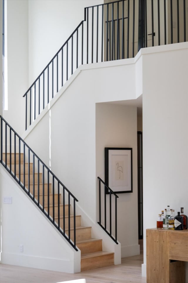 2578 Players Ct, Wellington, FL 33414 - stairs featuring a high ceiling and wood-type flooring