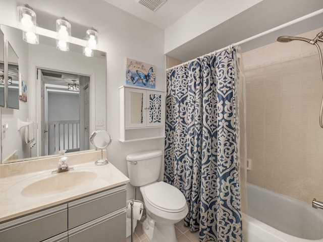 full bathroom with tile patterned flooring, vanity, shower / bath combo, and toilet