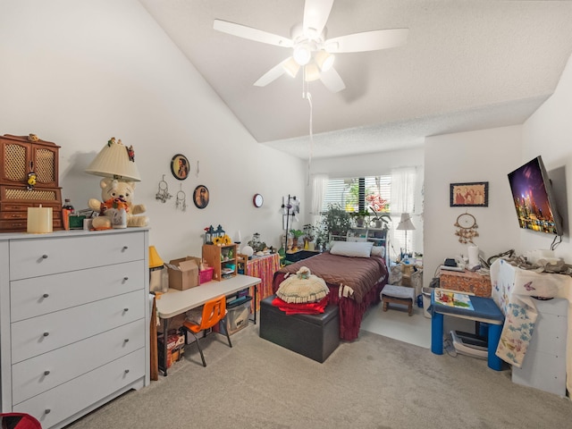 bedroom with light colored carpet, a textured ceiling, and ceiling fan