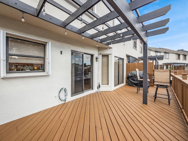 wooden deck featuring a pergola