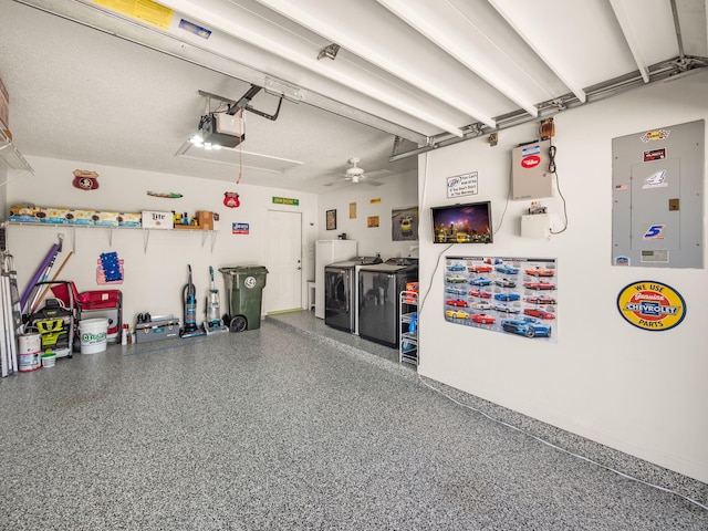 garage featuring ceiling fan, a garage door opener, electric panel, and washer and dryer