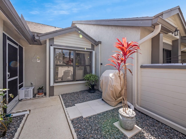 property entrance with a patio