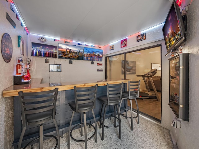 bar featuring wood counters