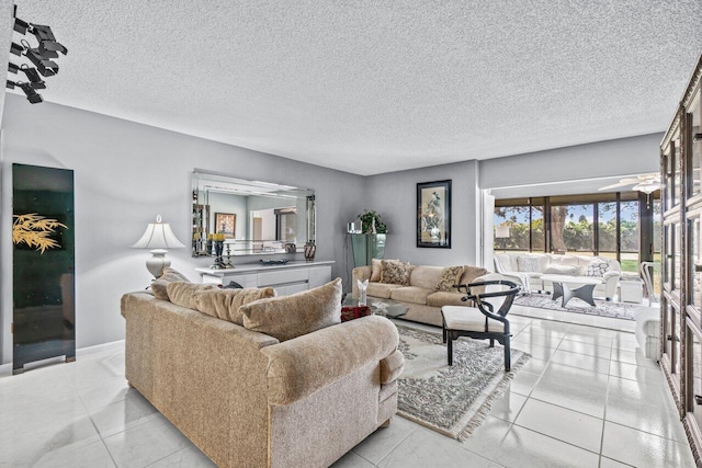 living room with light tile patterned floors and a textured ceiling