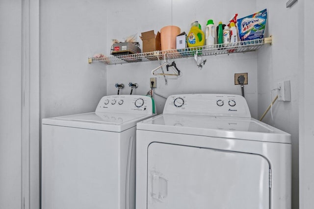 clothes washing area featuring independent washer and dryer