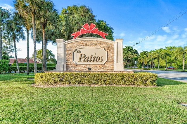 community sign with a lawn