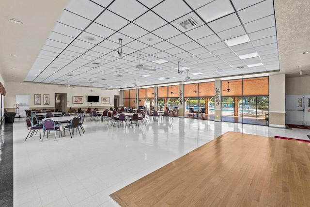 unfurnished dining area with a wall of windows