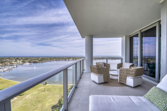 balcony featuring a water view