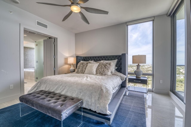 bedroom featuring ceiling fan, floor to ceiling windows, and connected bathroom