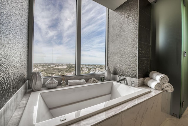 bathroom with tiled tub