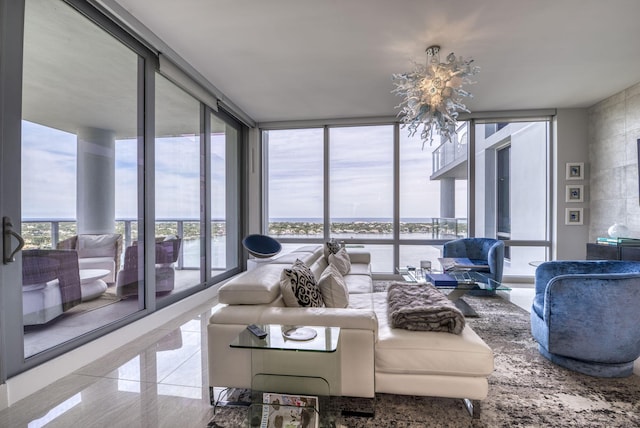 living room with a wall of windows and a healthy amount of sunlight