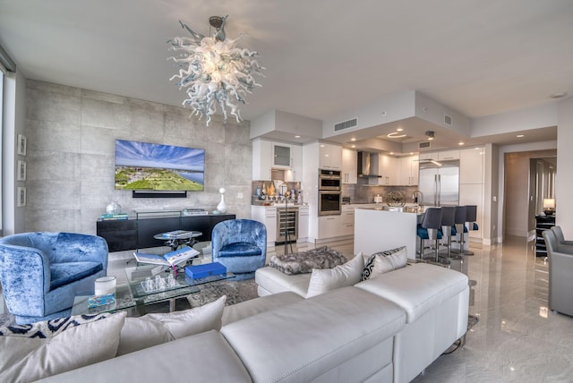 living room featuring sink and tile walls