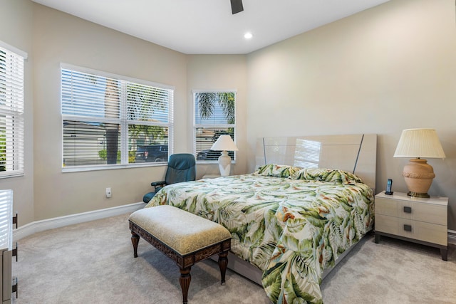 bedroom with light colored carpet and ceiling fan