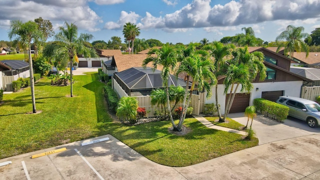 view of front of property featuring glass enclosure, a residential view, and a front lawn