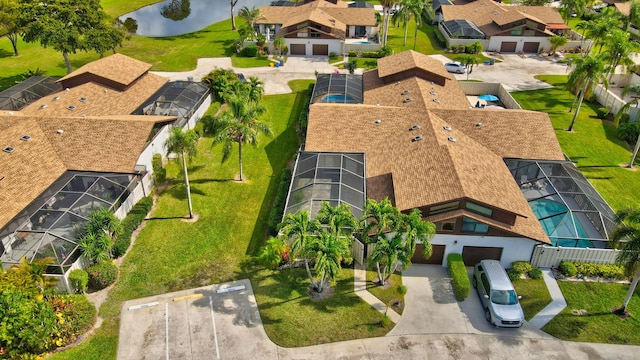 aerial view featuring a water view and a residential view