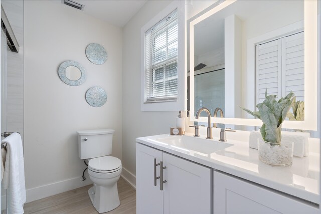 bathroom featuring wood-type flooring and walk in shower