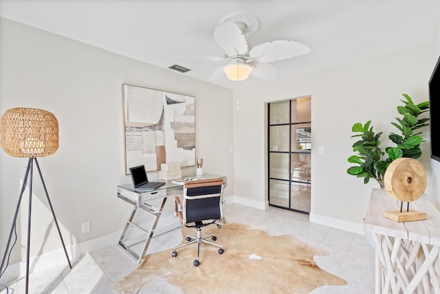 office featuring light tile patterned floors and ceiling fan