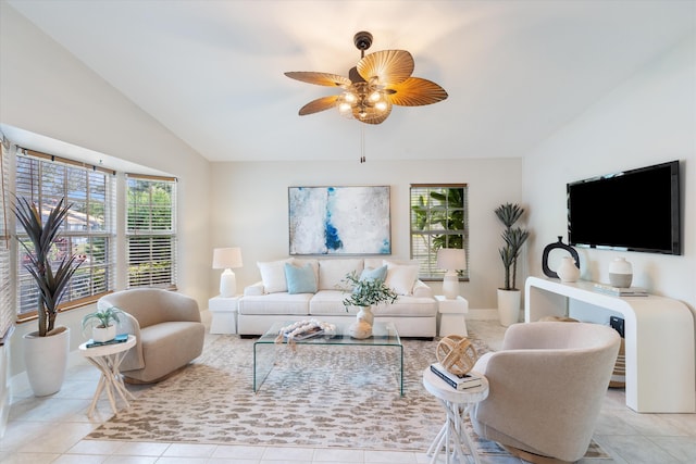 tiled living room with ceiling fan and lofted ceiling