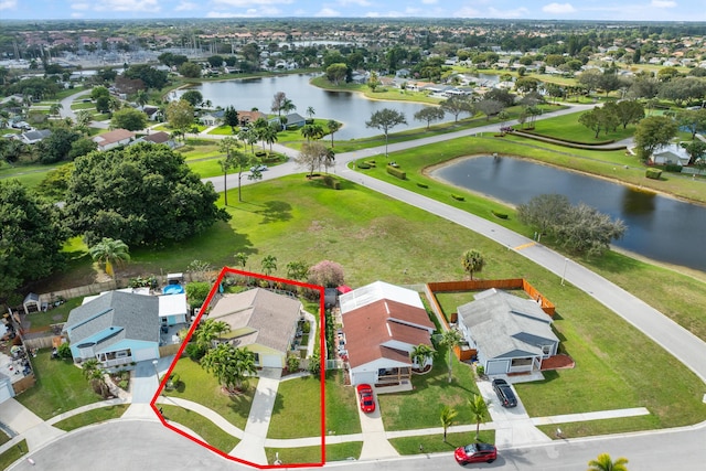 birds eye view of property with a water view