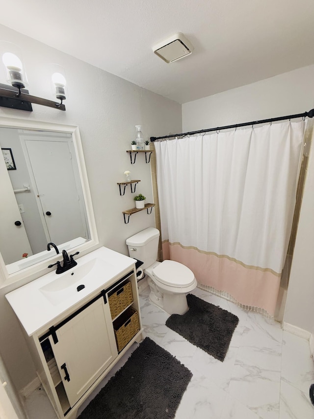 bathroom with vanity, a shower with curtain, and toilet