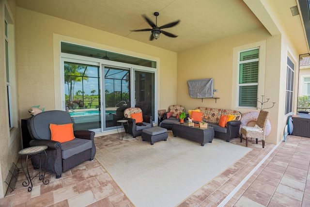 view of patio featuring an outdoor living space and ceiling fan