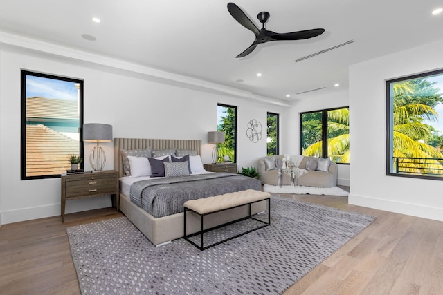 bedroom with hardwood / wood-style flooring and ceiling fan