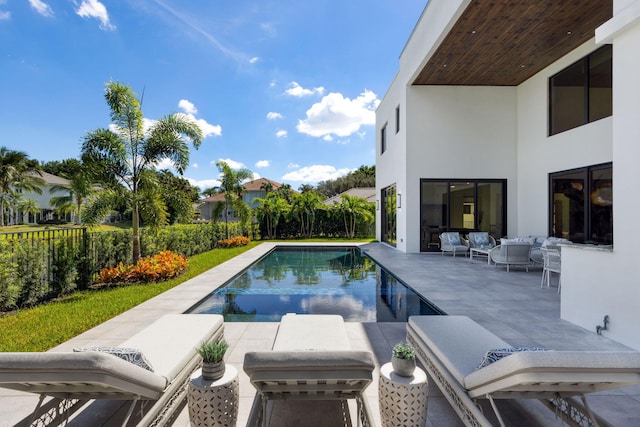 view of swimming pool with outdoor lounge area and a patio area