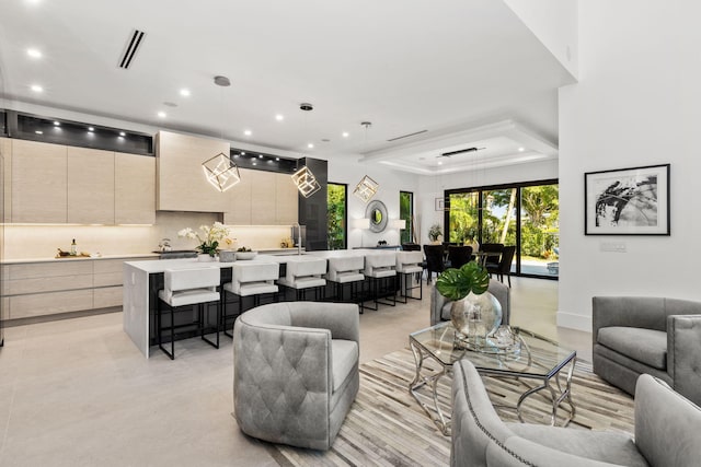 living room with a tray ceiling