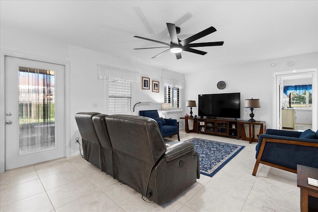 living room featuring light tile patterned floors and ceiling fan