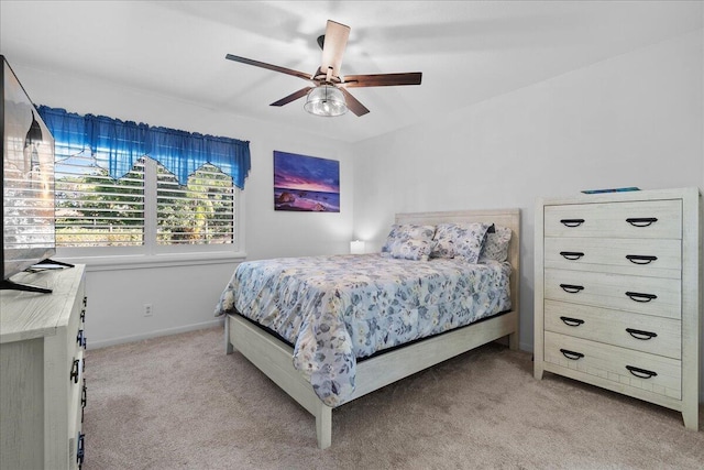 bedroom featuring light carpet and ceiling fan