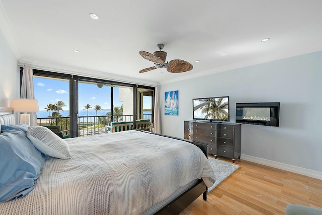 bedroom with expansive windows, ornamental molding, access to outside, ceiling fan, and light hardwood / wood-style floors