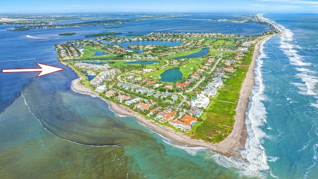 aerial view featuring a water view and a view of the beach