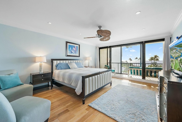 bedroom featuring expansive windows, access to exterior, ceiling fan, light hardwood / wood-style floors, and crown molding