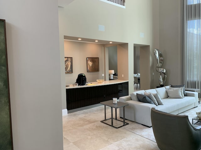 living room featuring a high ceiling