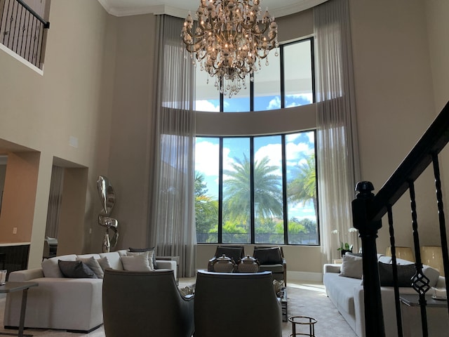 interior space with a high ceiling and an inviting chandelier